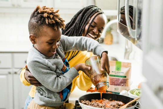 Attractive Family Preparing Weight Loss Meal